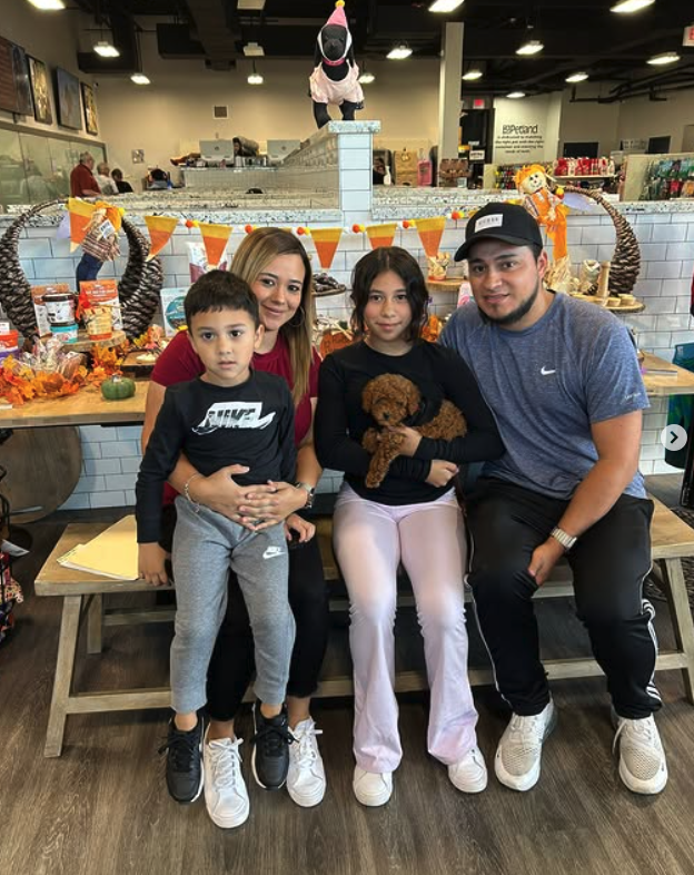 A family spending time with a Poodle
