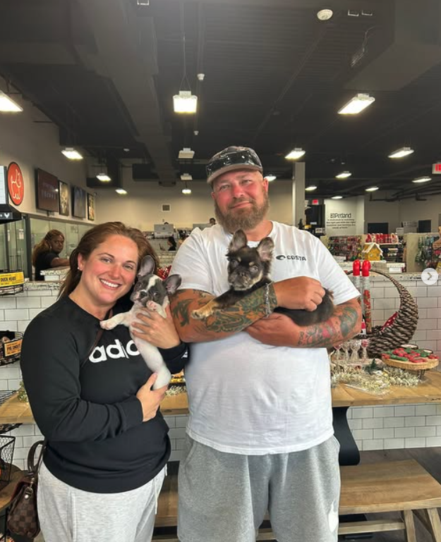 A family spending time with a French Bulldog